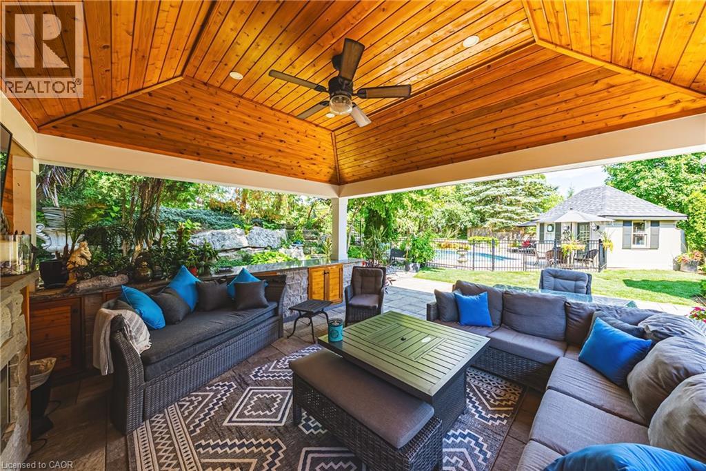 Covered patio with a natural wood-finish vaulted ceiling and recessed lighting - 33 Golfview Crescent, Dundas, ON - Outdoor With Deck Patio Veranda With Exterior
