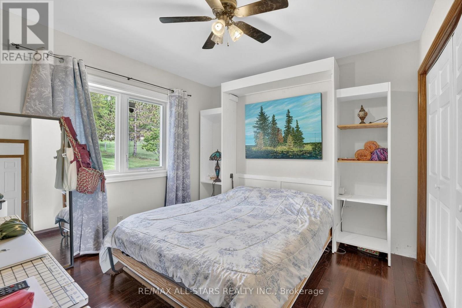 Main level 3rd bedroom with Murphy Bed - 10655 Sideroad 17, Brock, ON