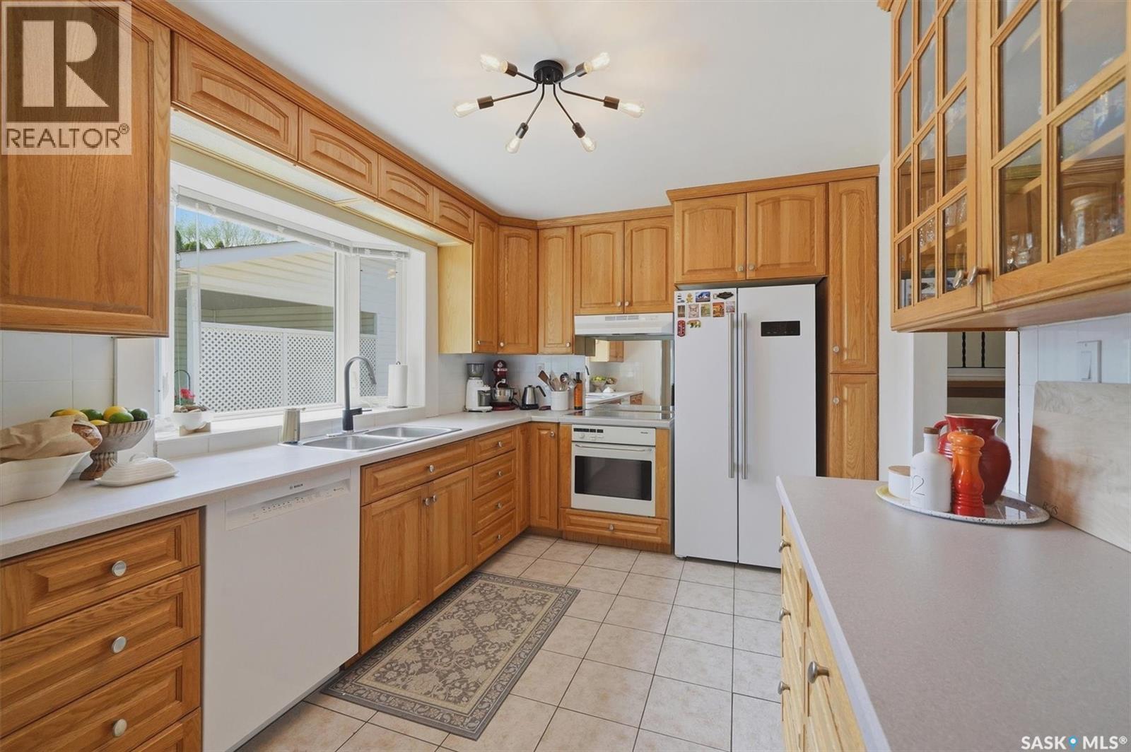 52 Potter Crescent, Saskatoon, SK - Indoor Photo Showing Kitchen With Double Sink