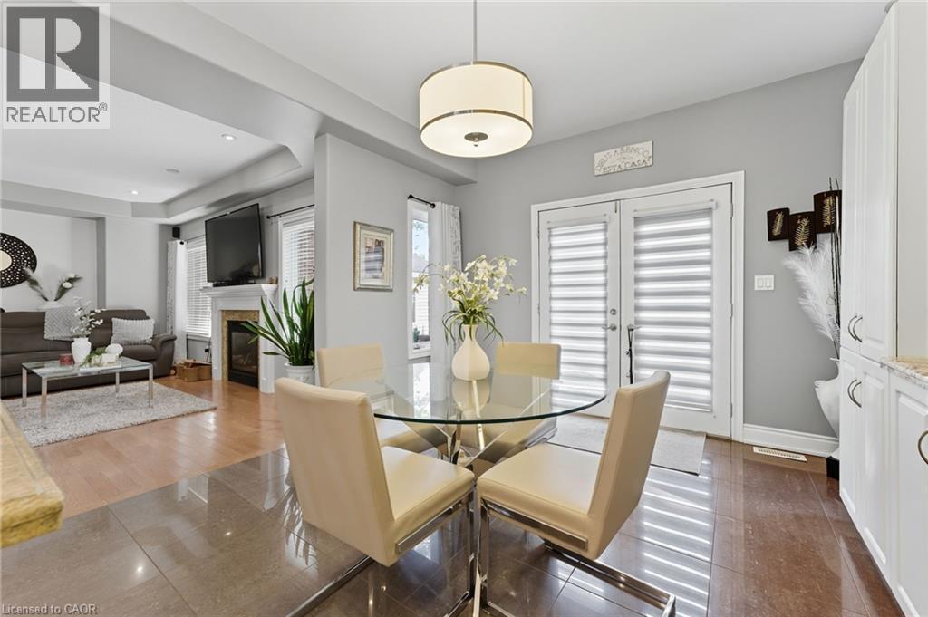 23 Kellogg Avenue, Hamilton, ON - Indoor Photo Showing Dining Room With Fireplace