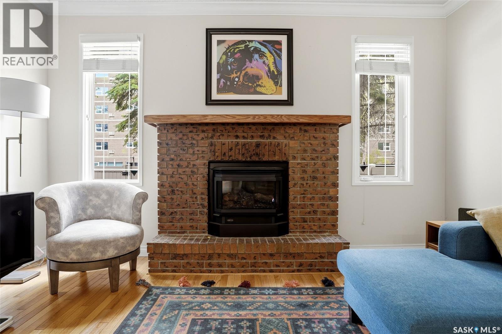 2231 Mcintyre Street, Regina, SK - Indoor Photo Showing Living Room With Fireplace