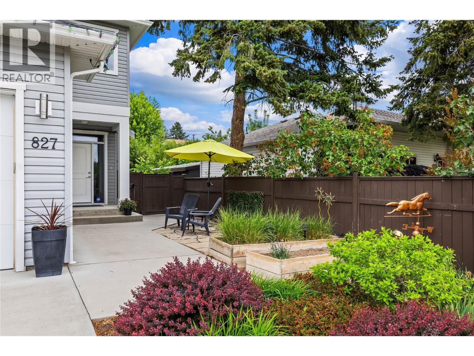Private Entry - Flanked by Gardens Plots, Flagstone Patio and Concrete Walkways - 827 Juniper Road, Kelowna, BC - Outdoor