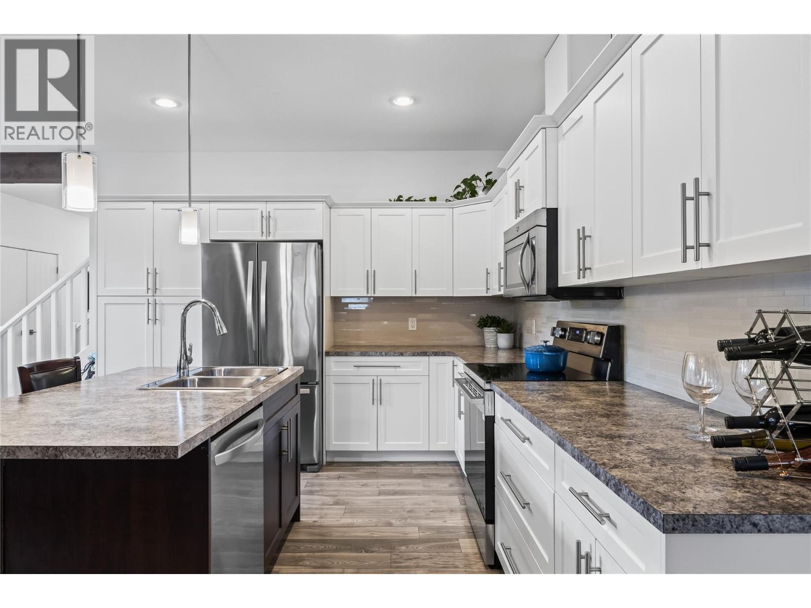 Stainless Steel Appliances - 827 Juniper Road, Kelowna, BC - Indoor Photo Showing Kitchen With Double Sink With Upgraded Kitchen