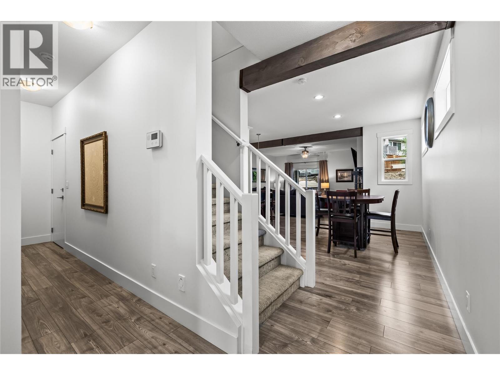 Stairs to Basement at end of Hall. Stairs to Upper Level - 827 Juniper Road, Kelowna, BC - Indoor Photo Showing Other Room