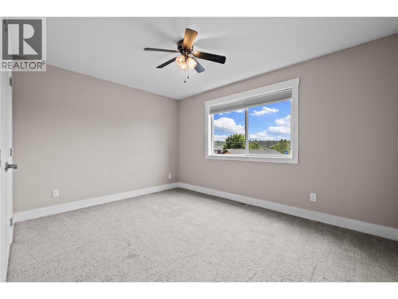 Large front Bedroom with Large Closet - 827 Juniper Road, Kelowna, BC - Indoor Photo Showing Other Room