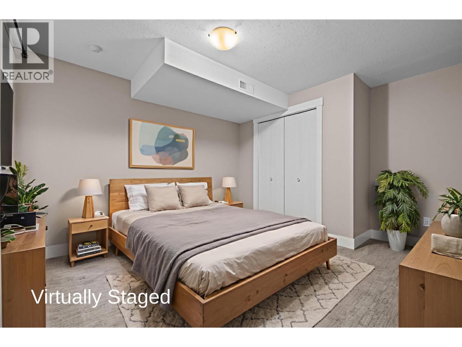 Virtually Staged - Large Bedroom with Closet - 827 Juniper Road, Kelowna, BC - Indoor Photo Showing Bedroom