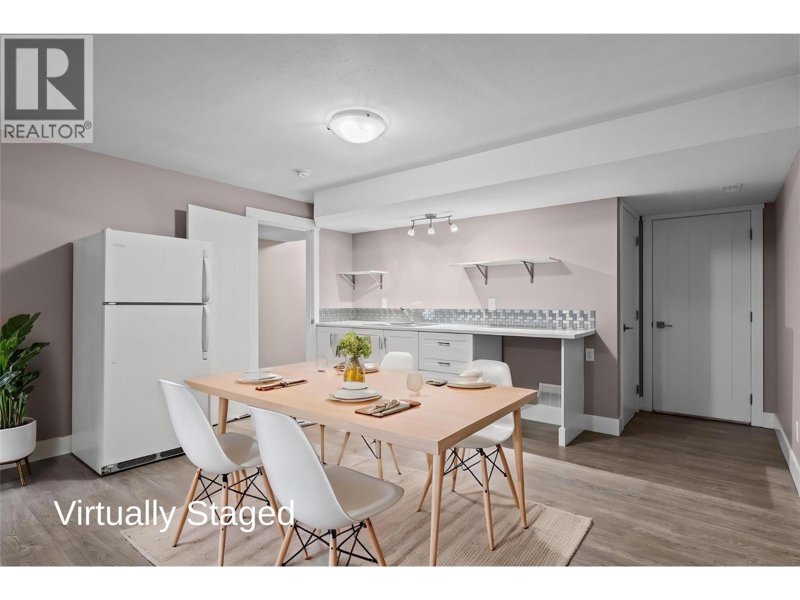 Virtually Staged - Kitchen, Dining Space with Fridge, Built-Ins and Double Sink - 827 Juniper Road, Kelowna, BC - Indoor Photo Showing Dining Room