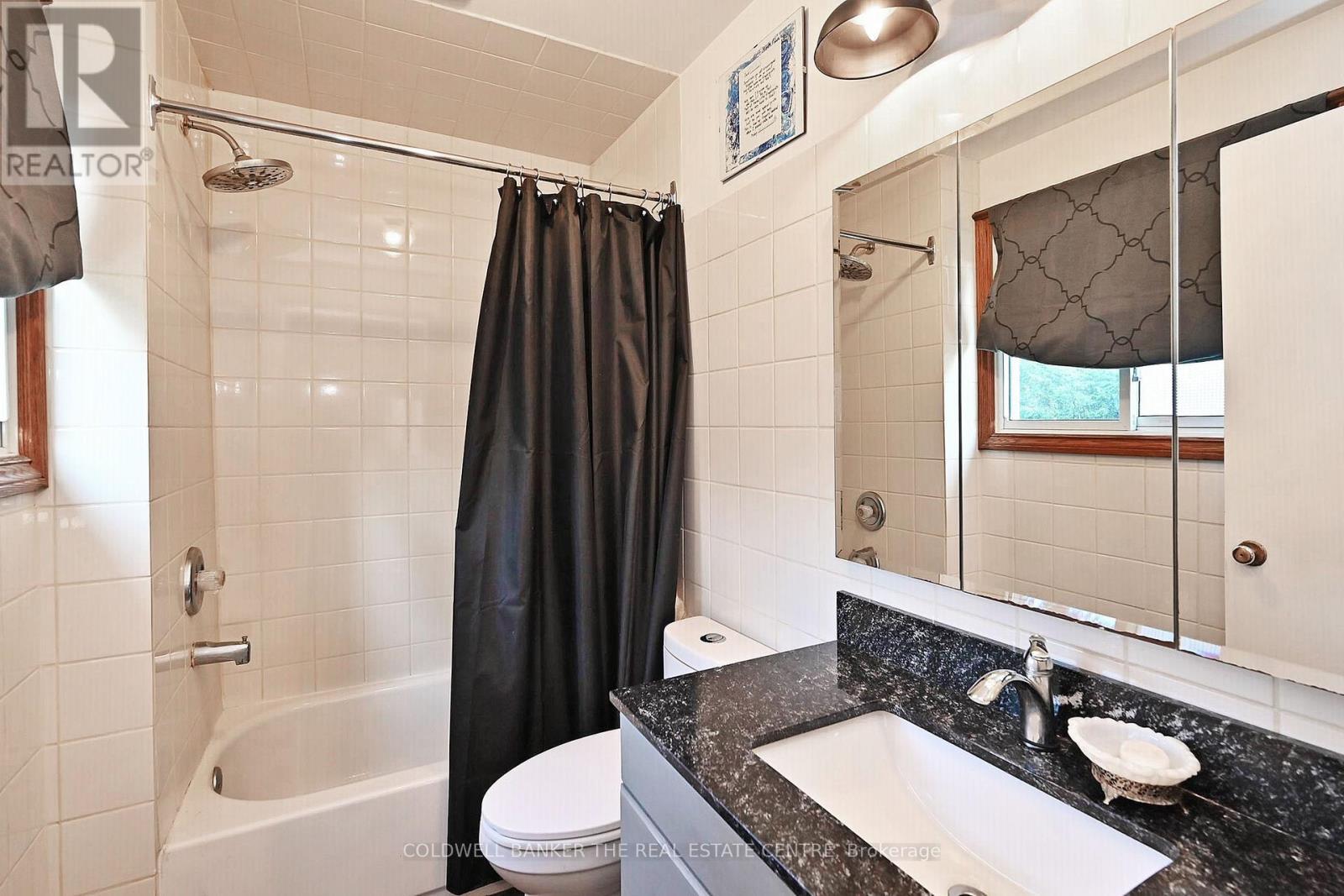 updated full family bath - 20805 Brock Road, Brock, ON - Indoor Photo Showing Laundry Room