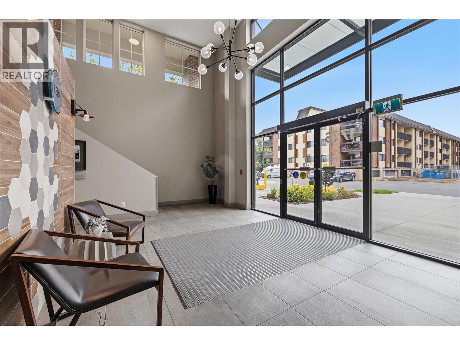 Welcoming entryway showcasing modern design and thoughtful functionality. - 1775 Chapman Place Unit# 101, Kelowna, BC - Indoor Photo Showing Other Room