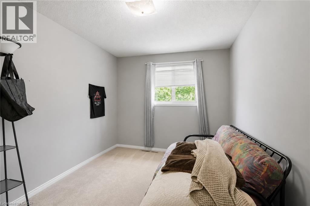 Virtually Staged - 565 Rymal Road E Unit# 2, Hamilton, ON - Indoor Photo Showing Bedroom