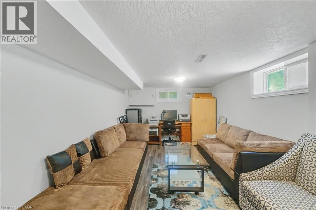Lower level living space with recessed lighting and a drop ceiling beam - 158 Plymouth Road, Kitchener, ON - Indoor Photo Showing Living Room
