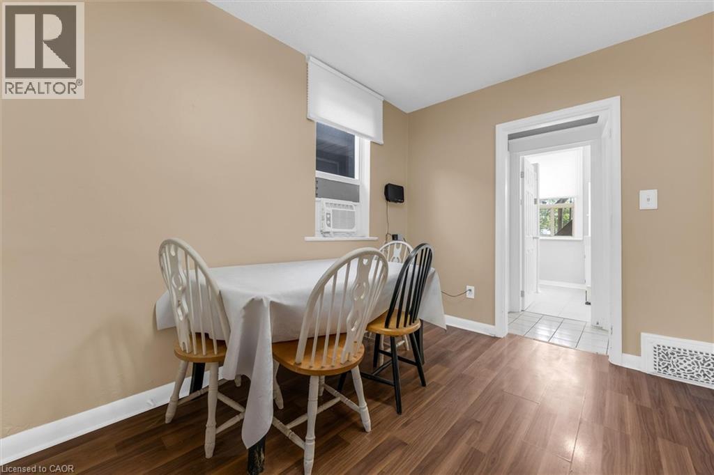 Interior room with wood-finish flooring and neutral-toned walls - 205 Ferguson Avenue S, Hamilton, ON - Indoor Photo Showing Dining Room