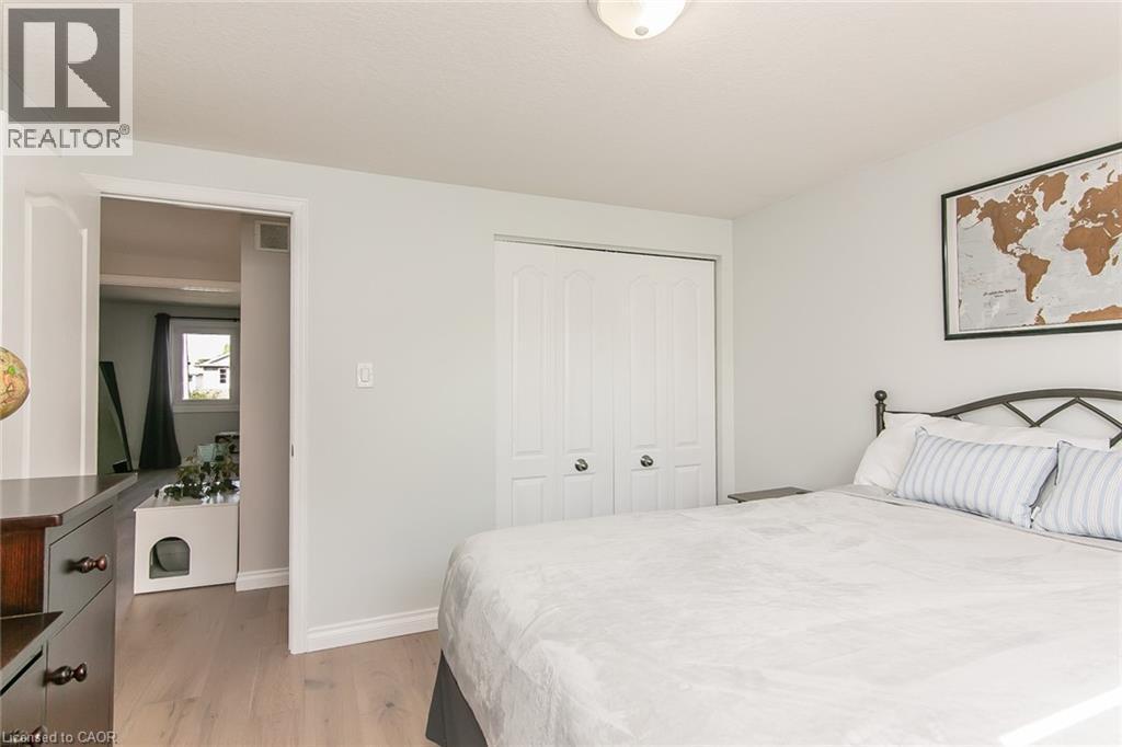 Light-toned wood-finish flooring throughout - 529 Chesapeake Crescent, Waterloo, ON - Indoor Photo Showing Bedroom