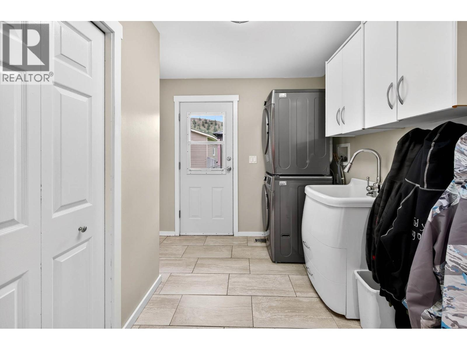 Laundry and entrance to both the garage and back yard - 6451 Beaver Crescent, Kamloops, BC