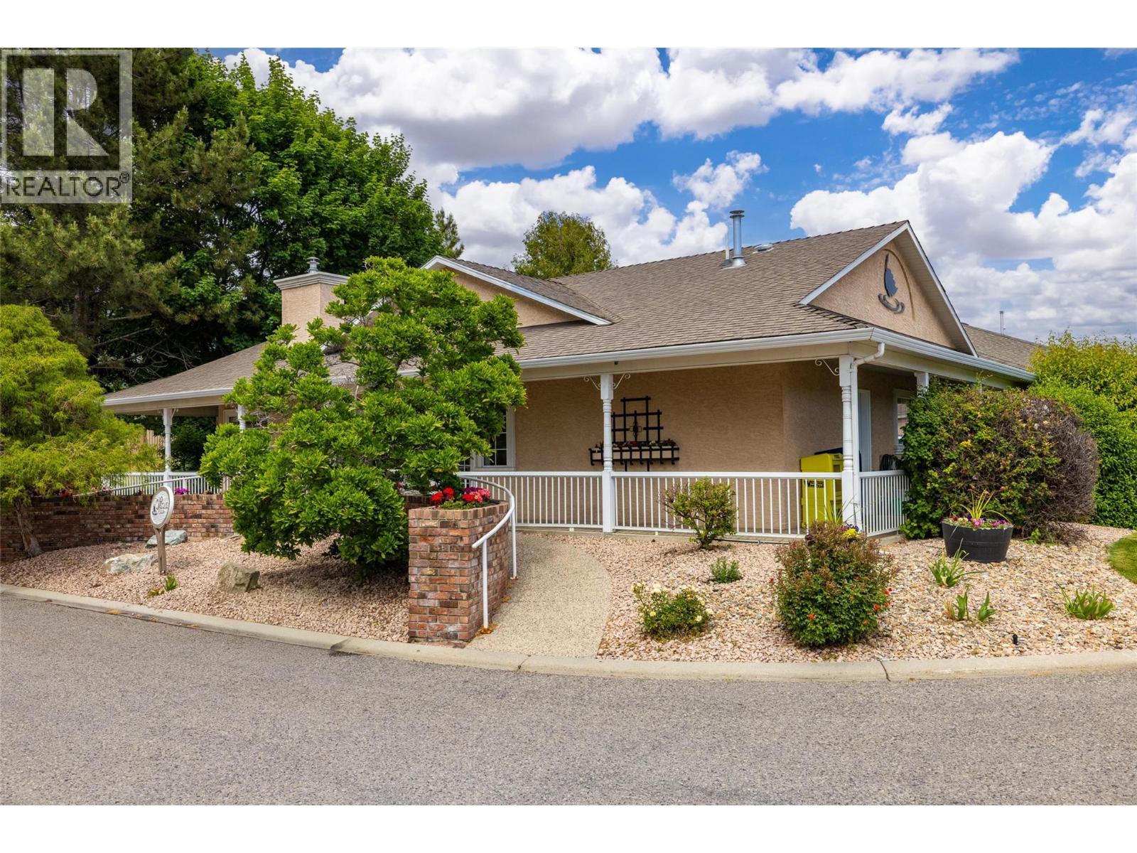 Residents have access to a clubhouse, fitness facilities, library, and social gathering spaces. - 2250 Louie Drive Unit# 69, Westbank, BC - Outdoor With Deck Patio Veranda