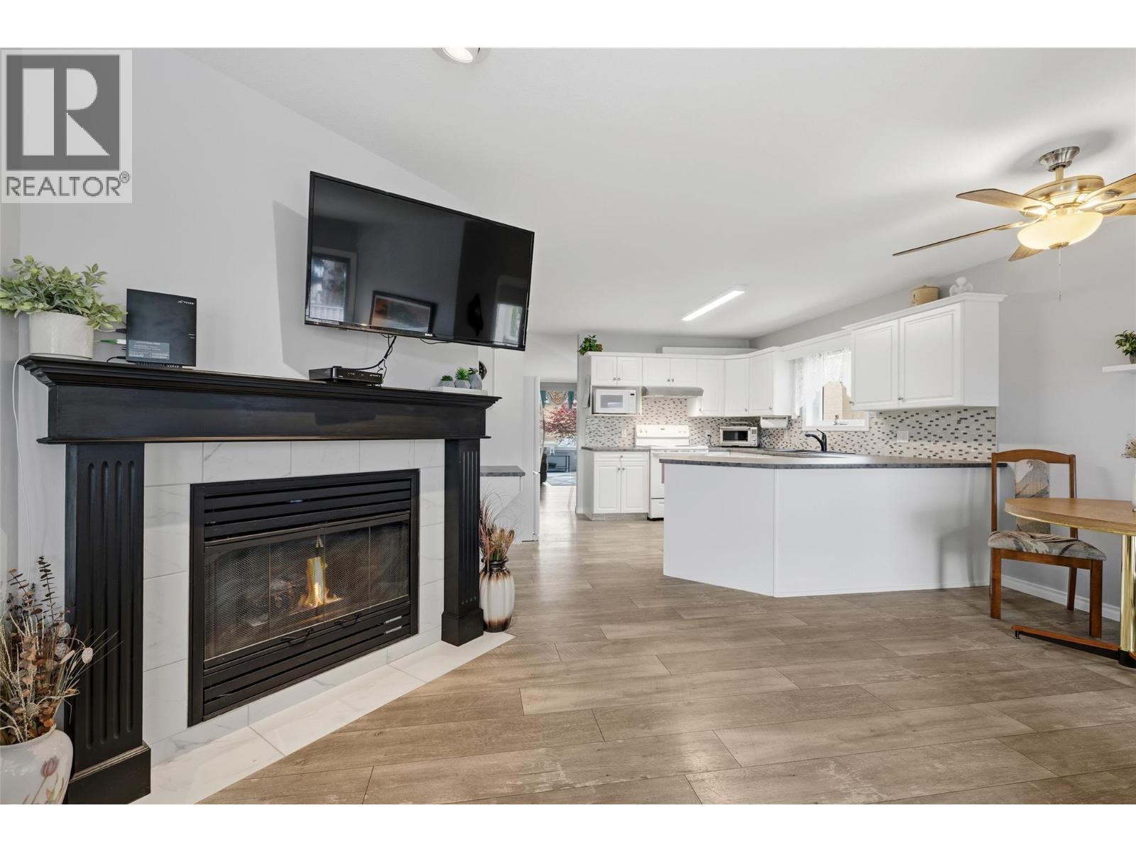 Family Room off of Kitchen w/Gas Fireplace - 2250 Louie Drive Unit# 69, Westbank, BC - Indoor Photo Showing Living Room With Fireplace