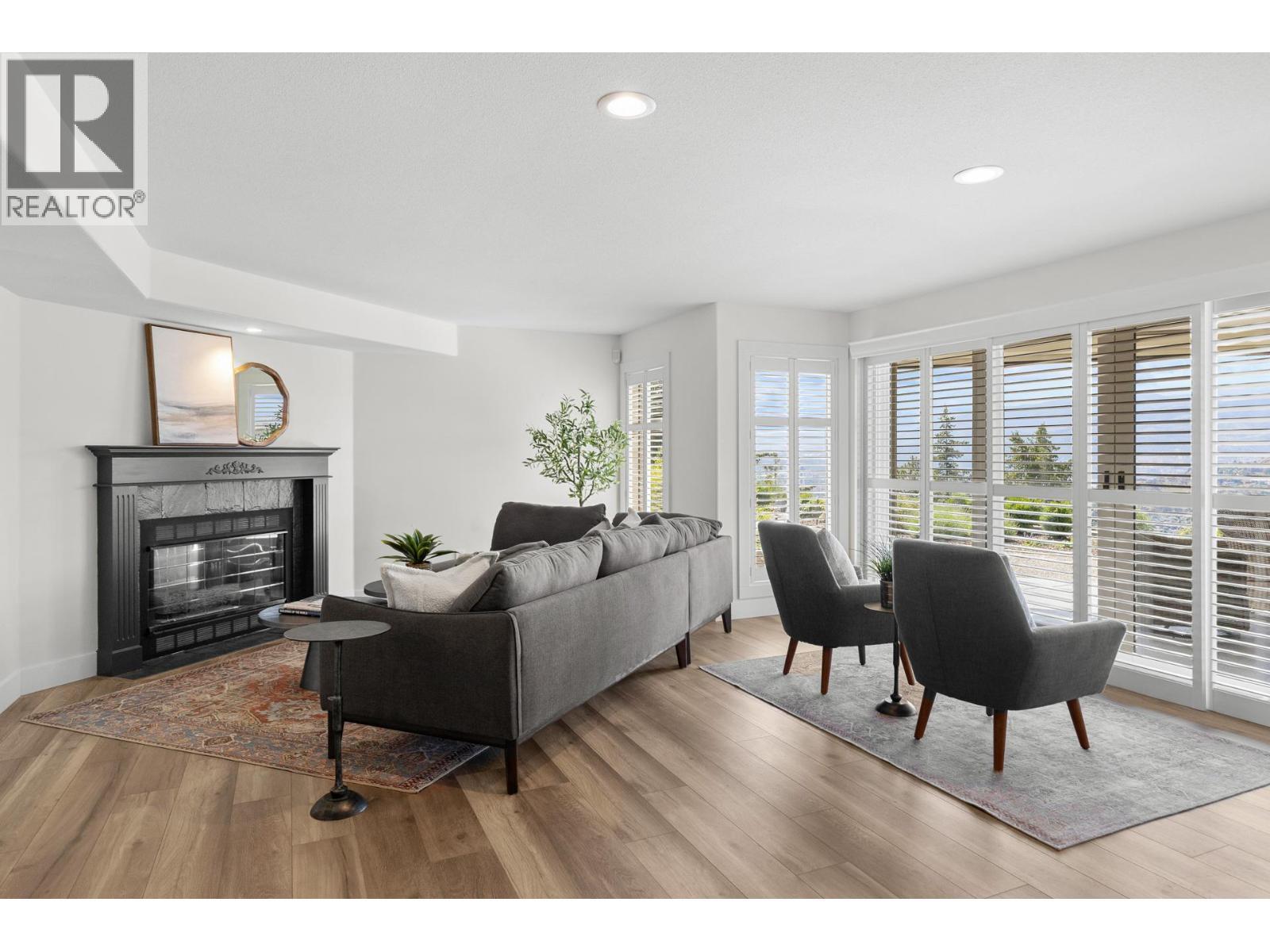 2150 Breckenridge Court, Kelowna, BC - Indoor Photo Showing Living Room With Fireplace