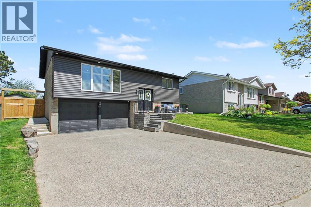 Split-level residence featuring a gray siding and brick exterior - 44 Oakhurst Crescent, Kitchener, ON - Outdoor