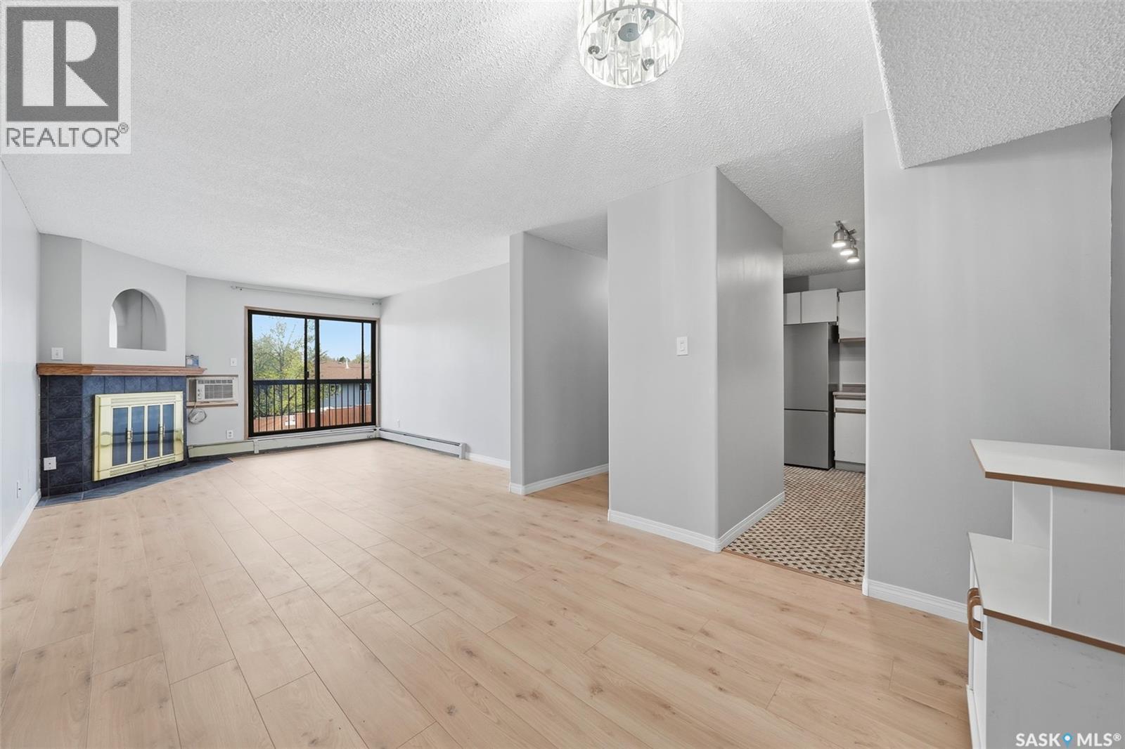 202 345 Kingsmere Boulevard, Saskatoon, SK - Indoor With Fireplace