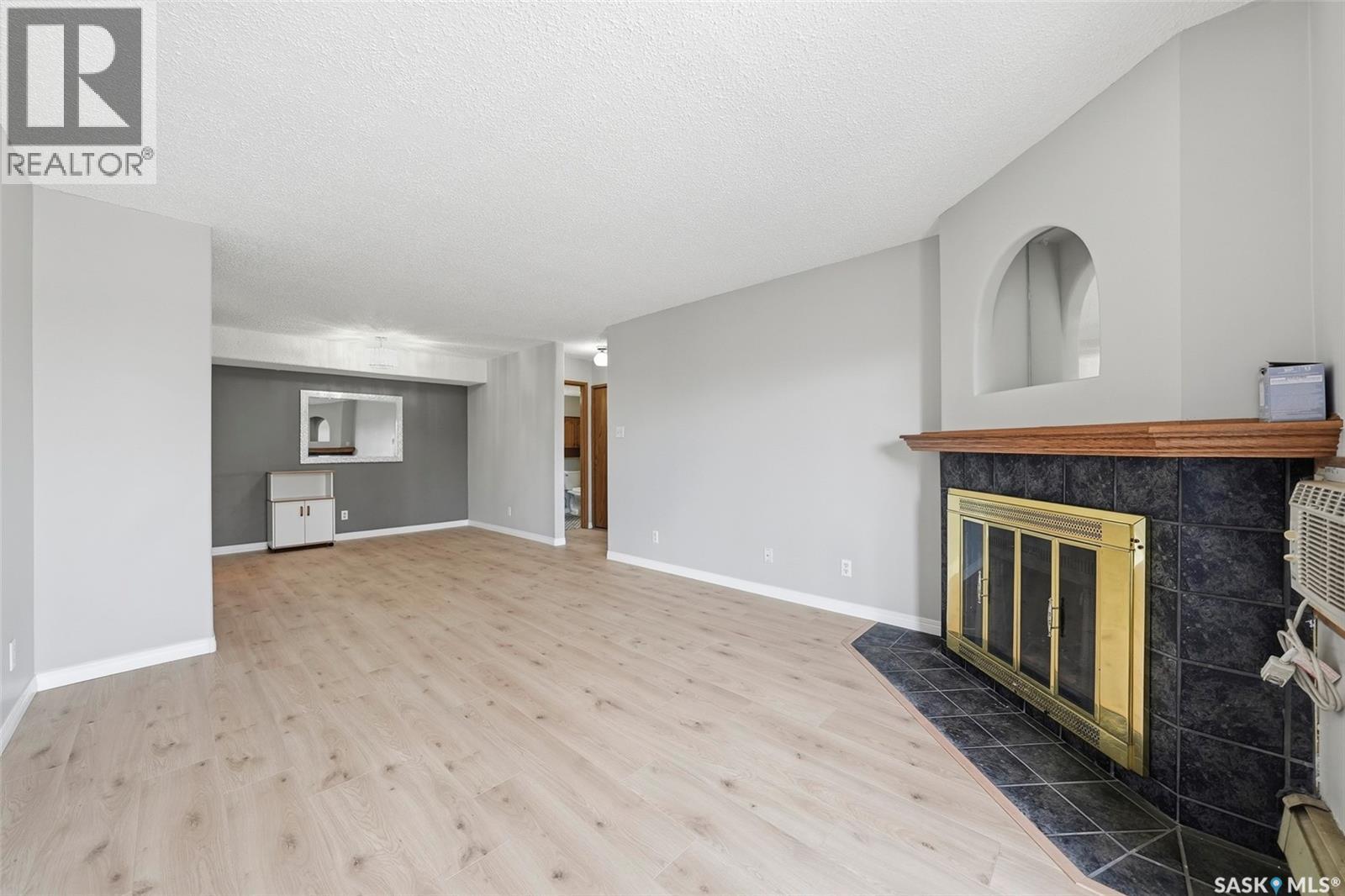 202 345 Kingsmere Boulevard, Saskatoon, SK - Indoor With Fireplace