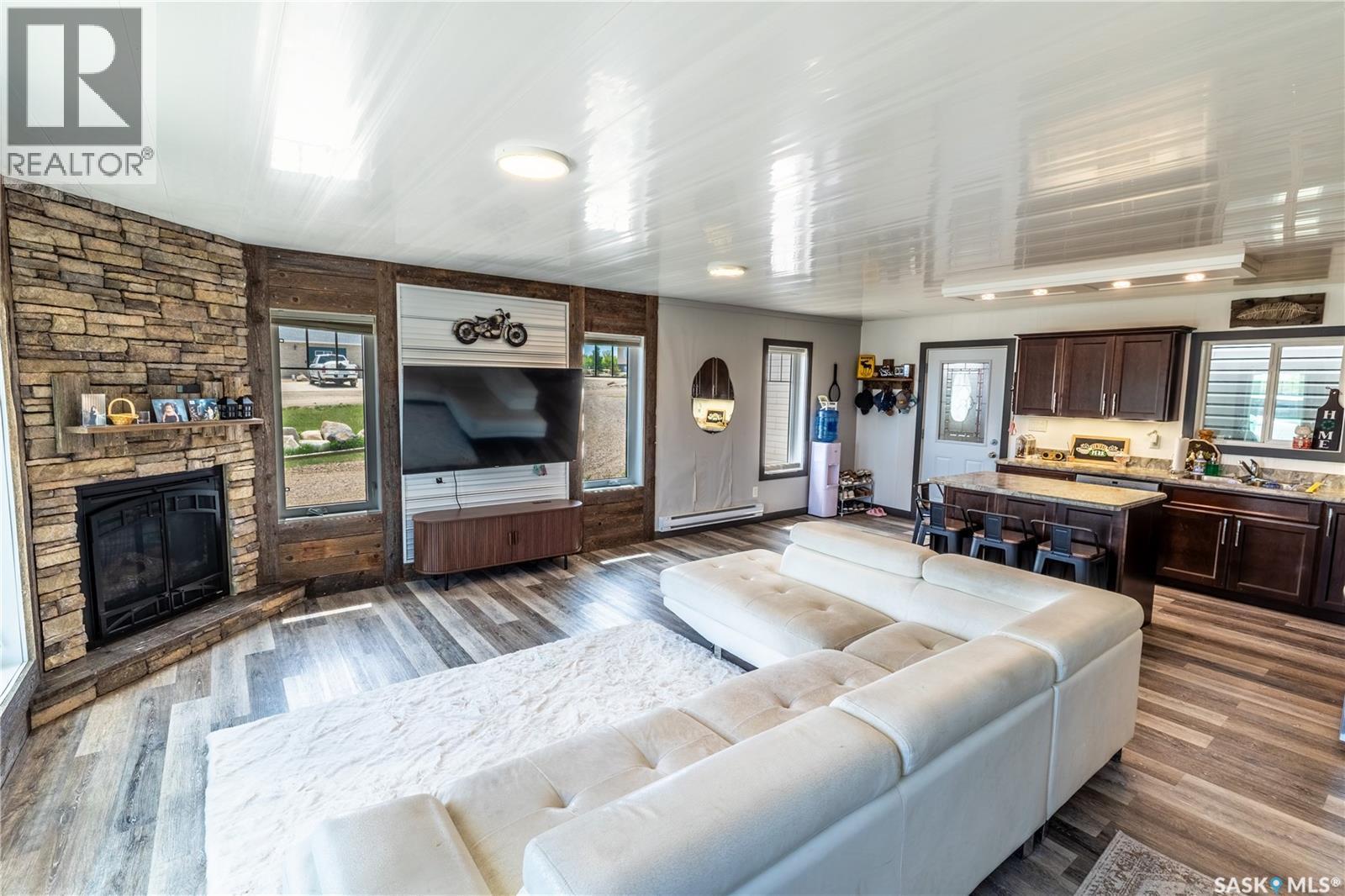 11 Sunrise Boulevard, Arm Lake, SK - Indoor Photo Showing Living Room With Fireplace