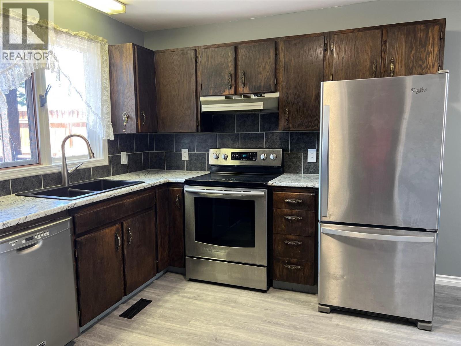 505 97A Avenue, Dawson Creek, BC - Indoor Photo Showing Kitchen With Double Sink
