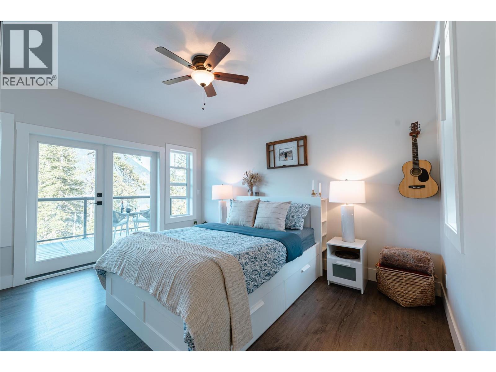 Main Bedroom, Patio Door to Deck w/ Breathtaking Views! - 8420 Highway 23 Highway S Lot# 1, Revelstoke, BC - Indoor Photo Showing Bedroom
