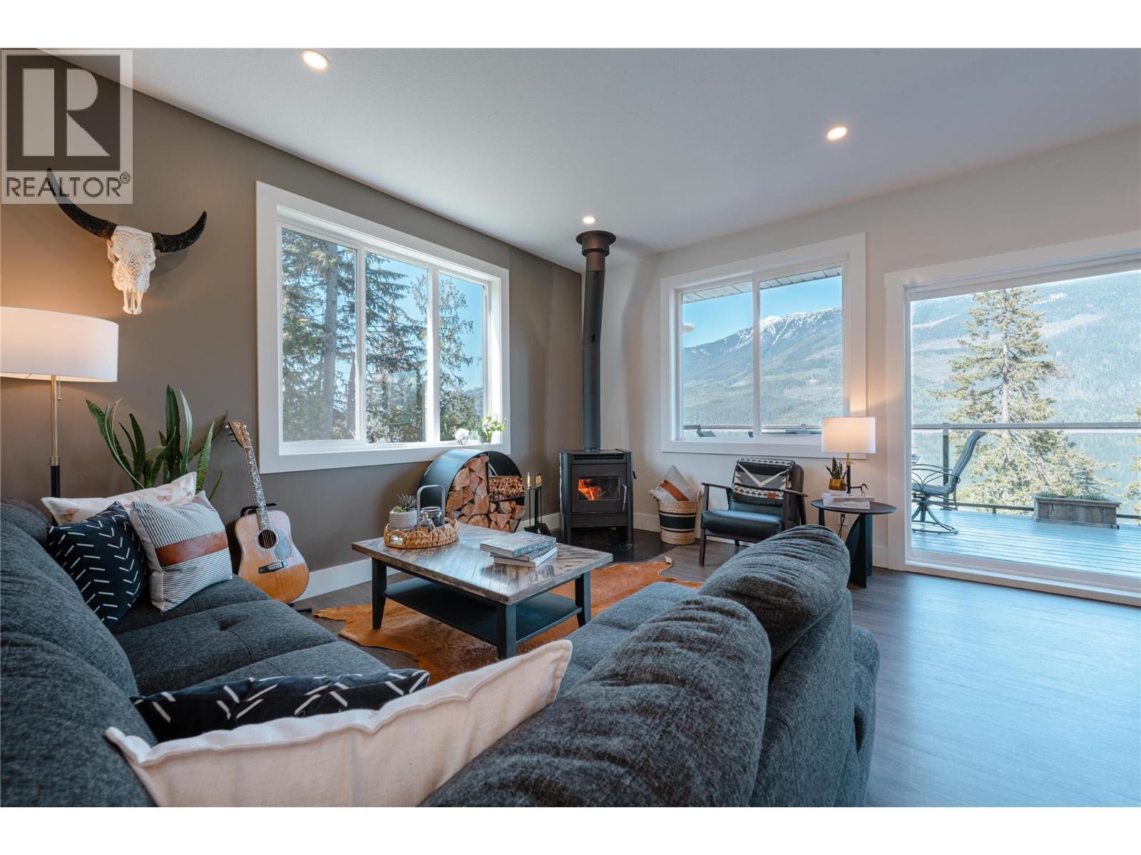Expansive Windows in Living Room. - 8420 Highway 23 Highway S Lot# 1, Revelstoke, BC - Indoor Photo Showing Living Room With Fireplace
