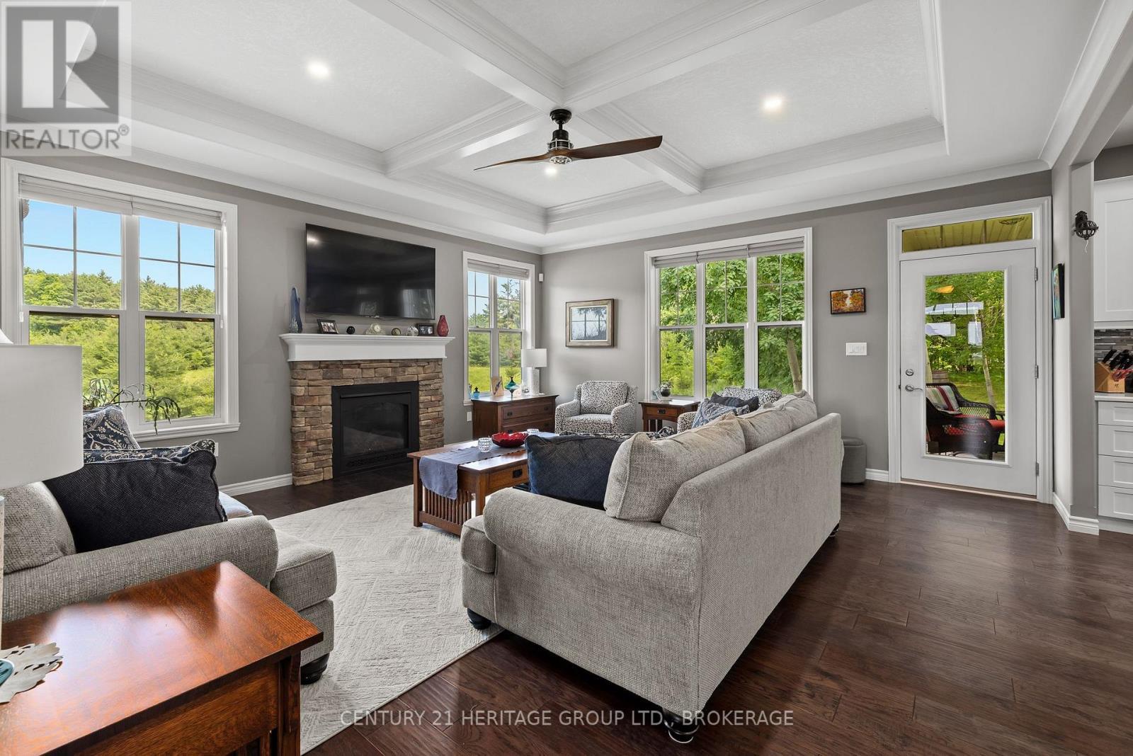 1071 Cranberry Cove Lane, Frontenac (Frontenac South), ON - Indoor Photo Showing Living Room With Fireplace
