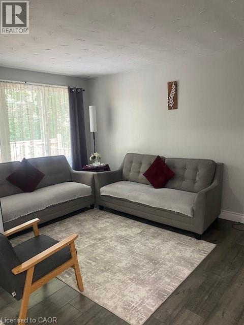 Living area featuring wood finished floors - 58 Hazelglen Drive, Kitchener, ON - Indoor Photo Showing Living Room