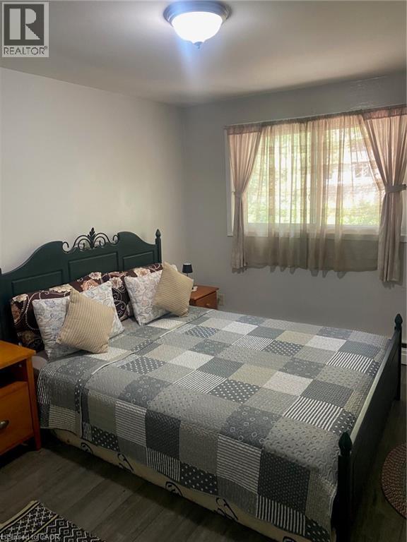 Bedroom featuring wood finished floors - 58 Hazelglen Drive, Kitchener, ON