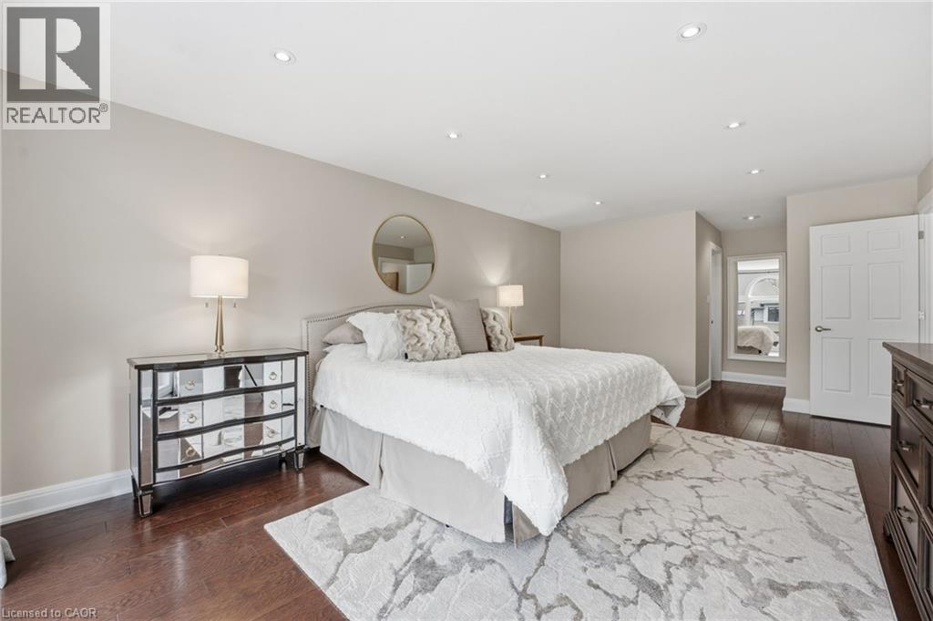 Bedroom with dark wood-type flooring and recessed lighting - 28 Deerview Avenue, Ancaster, ON
