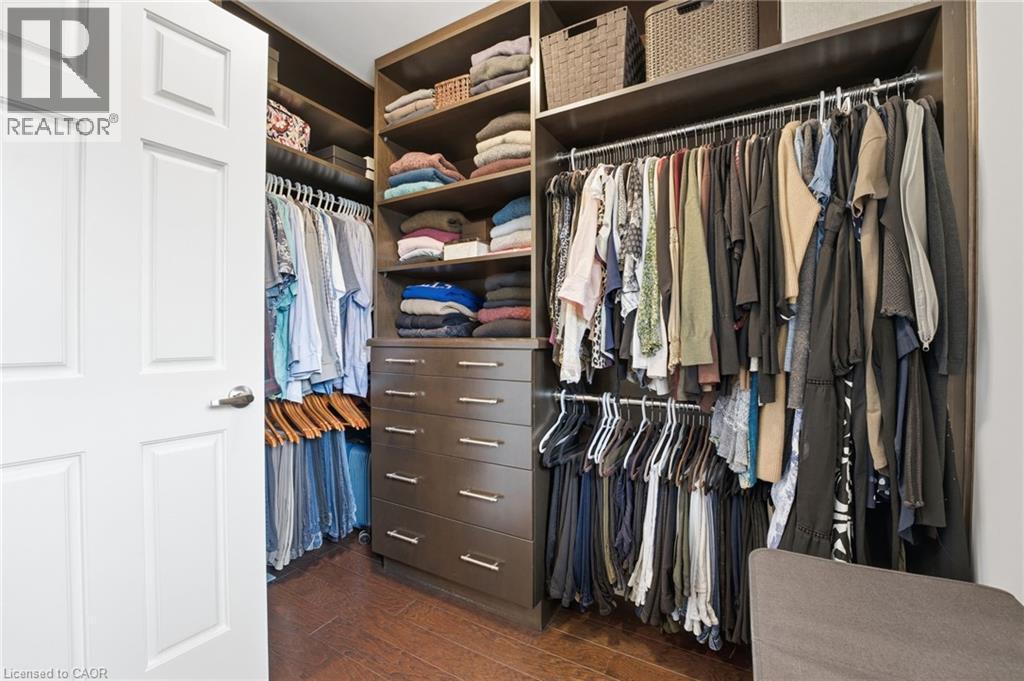 Walk in closet with dark wood finished floors - 28 Deerview Avenue, Ancaster, ON