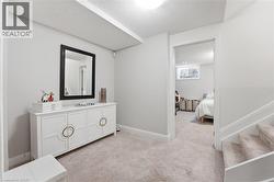 Bedroom featuring light colored carpet and a textured ceiling -