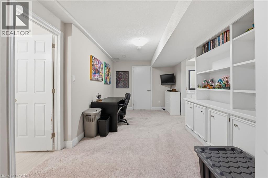 Home office with light colored carpet and baseboards - 28 Deerview Avenue, Ancaster, ON