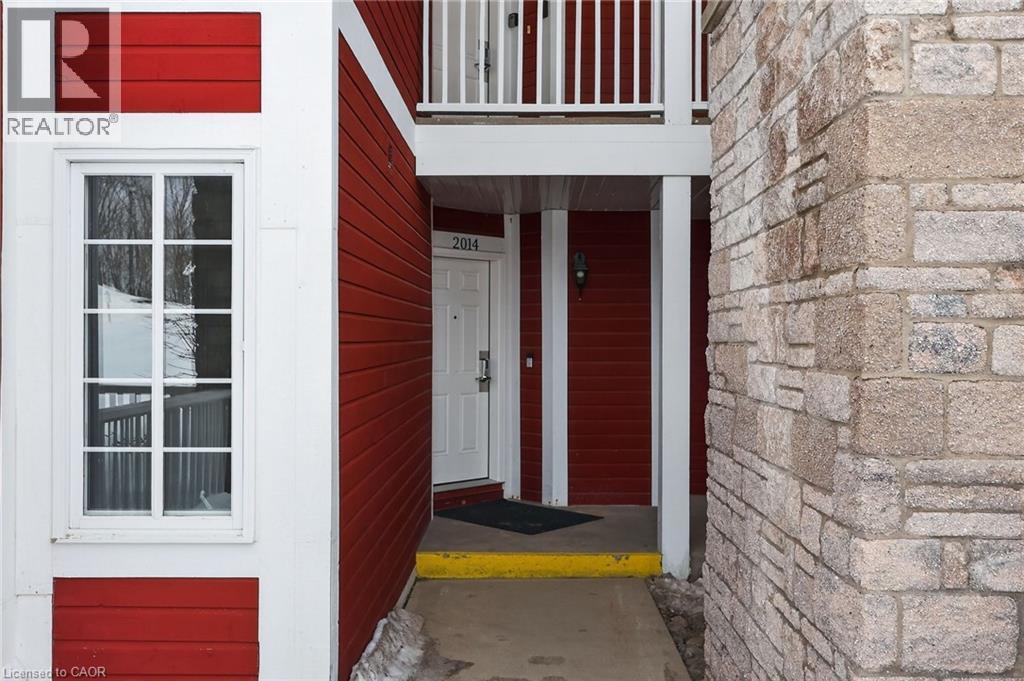 View of exterior entry with stone siding - 90 Highland Drive Unit# 2014/15, Simcoe, ON