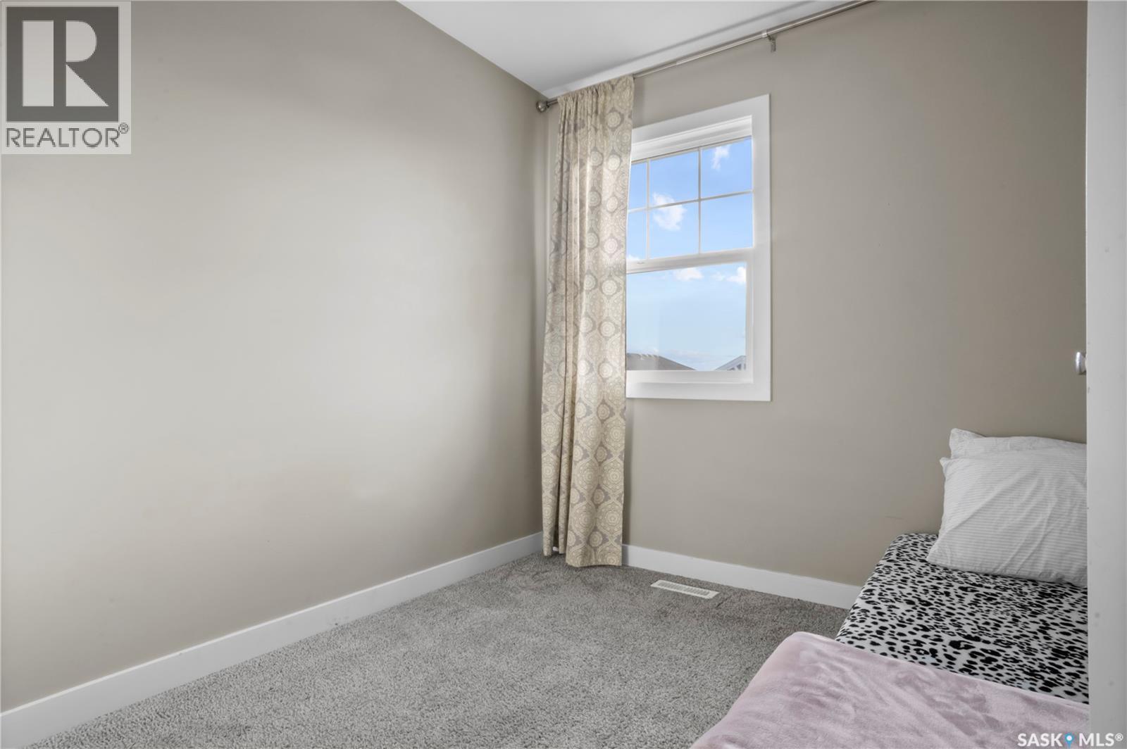4073 Delhaye Way, Regina, SK - Indoor Photo Showing Bedroom