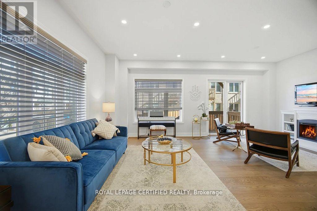 75 Borers Creek Circle, Hamilton, ON - Indoor Photo Showing Living Room With Fireplace