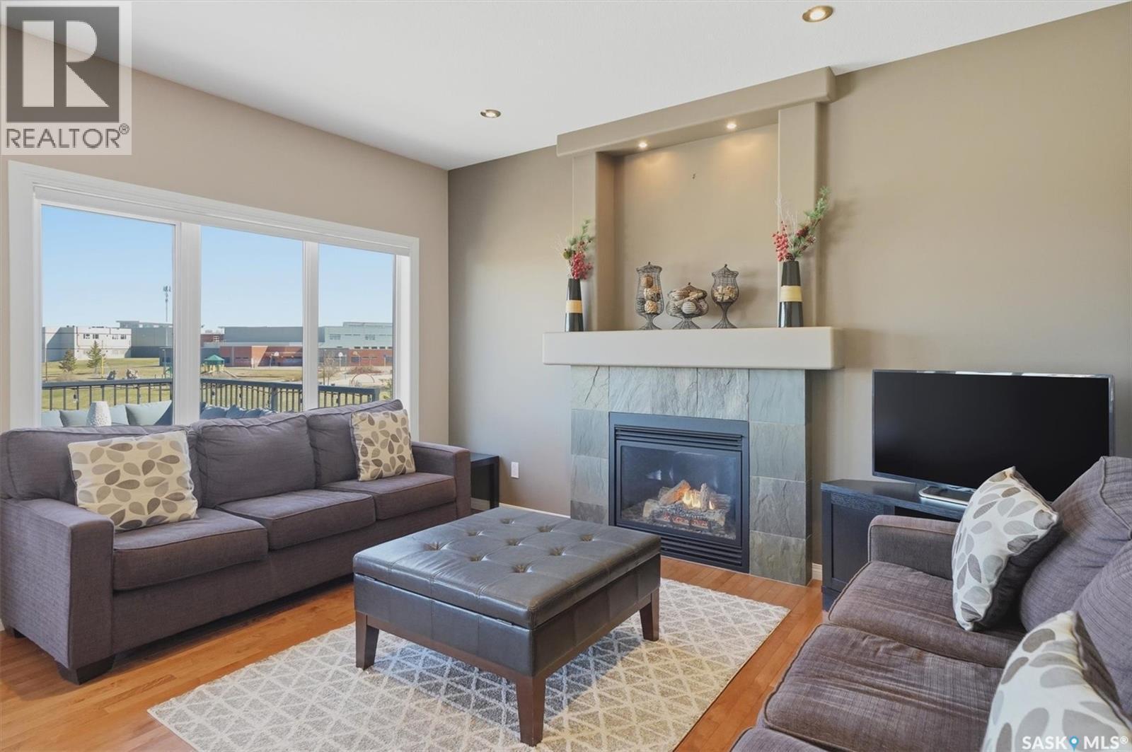 231 Willowgrove Boulevard, Saskatoon, SK - Indoor Photo Showing Living Room With Fireplace