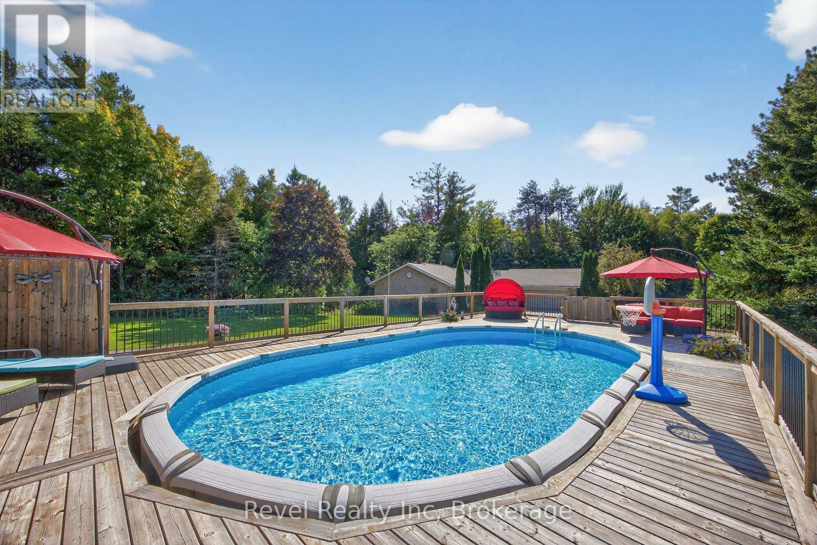 7190 93 Highway, Tiny, ON - Outdoor With Above Ground Pool With Backyard