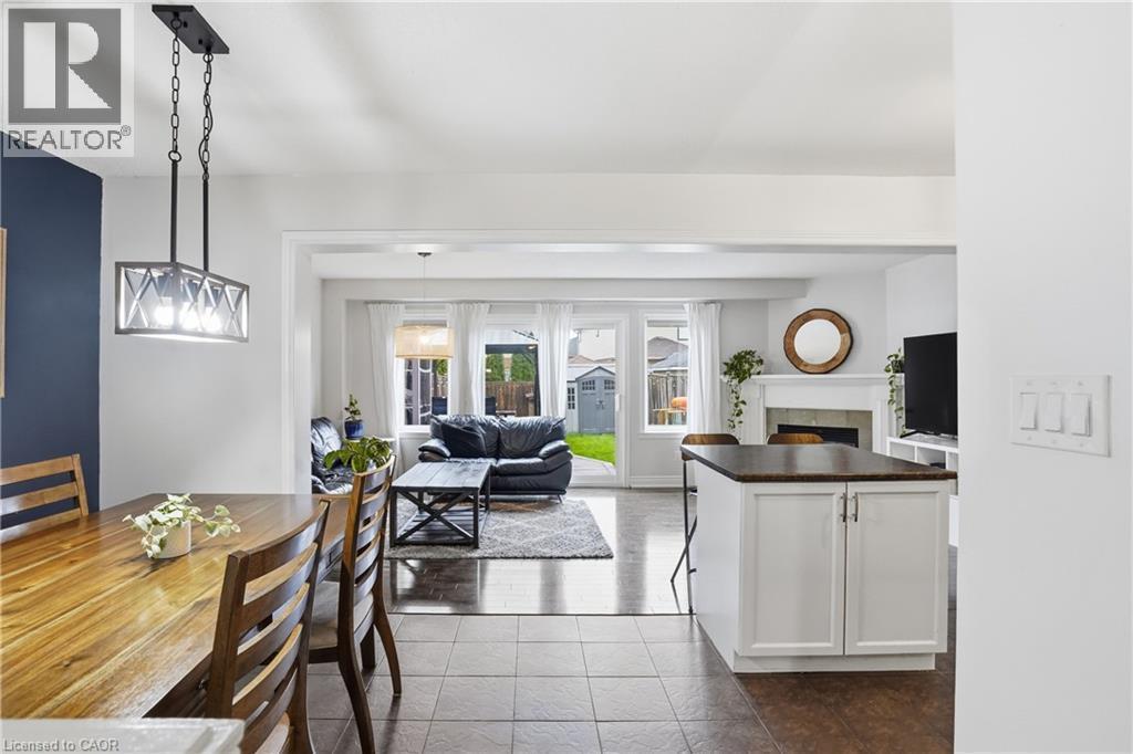 258 Fall Fair Way, Binbrook, ON - Indoor Photo Showing Dining Room With Fireplace
