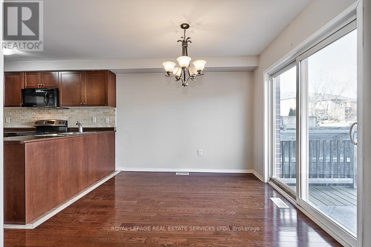 Dining Room with a Sliding Door Walkout to Deck - 3221 Sharp Road, Burlington, ON - Indoor Photo Showing Kitchen