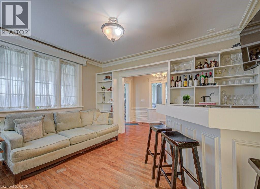 Built-in bar featuring extensive shelving and a white countertop - 2032 Coronation Boulevard, Cambridge, ON - Indoor