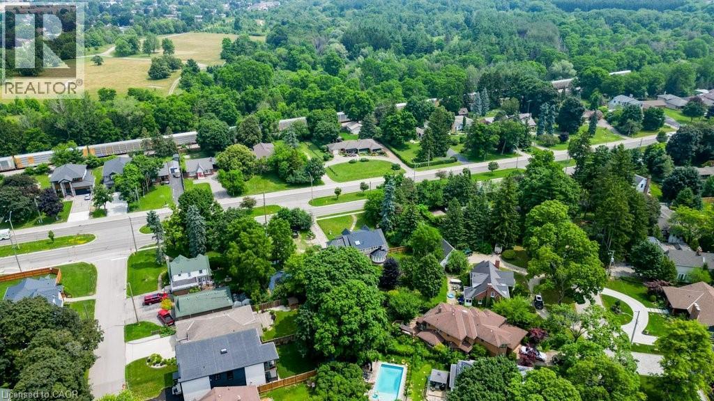Aerial perspective showcasing a residential area with mature trees, established roads, and varied housing styles - 2032 Coronation Boulevard, Cambridge, ON - Outdoor With View