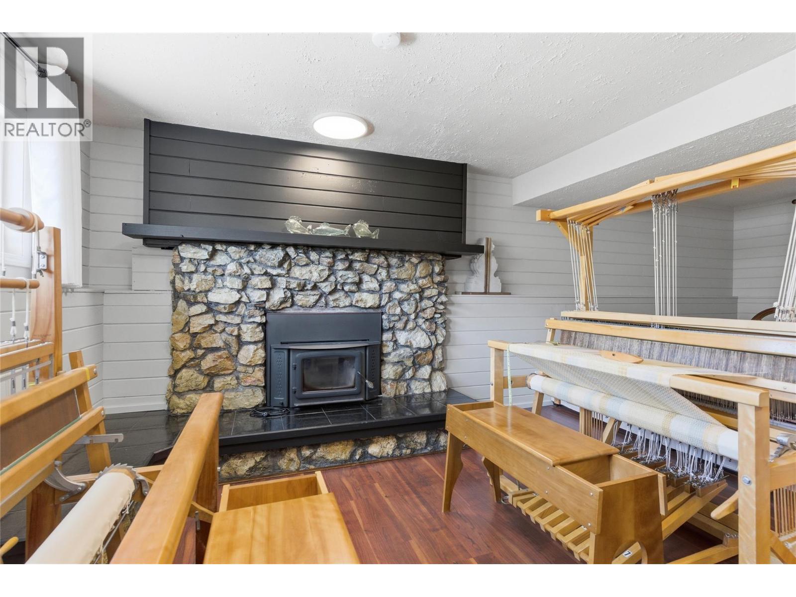 1153 Maclean Drive, Cache Creek, BC - Indoor Photo Showing Living Room With Fireplace