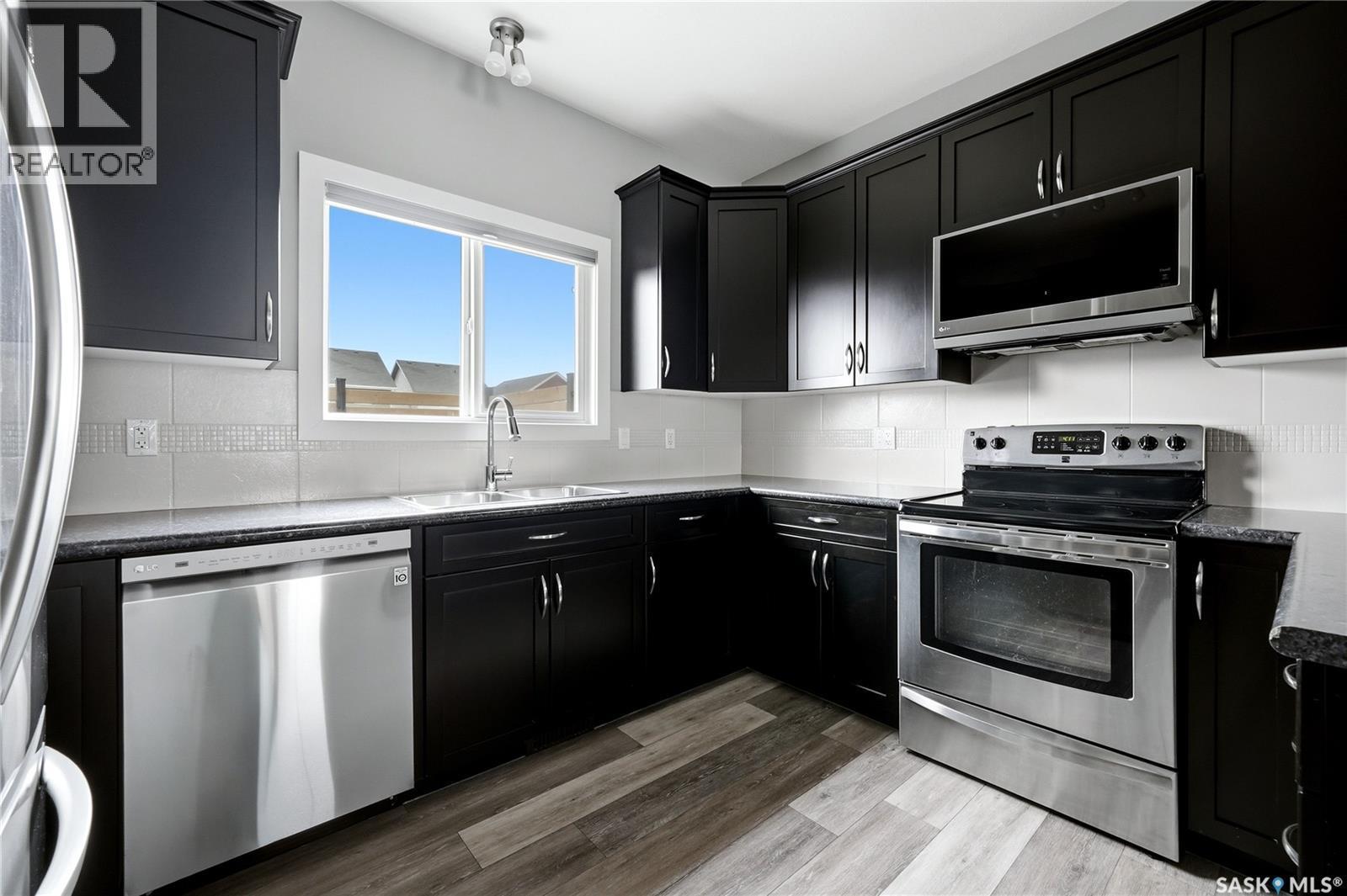 3636 Green Moss Lane, Regina, SK - Indoor Photo Showing Kitchen With Stainless Steel Kitchen With Double Sink