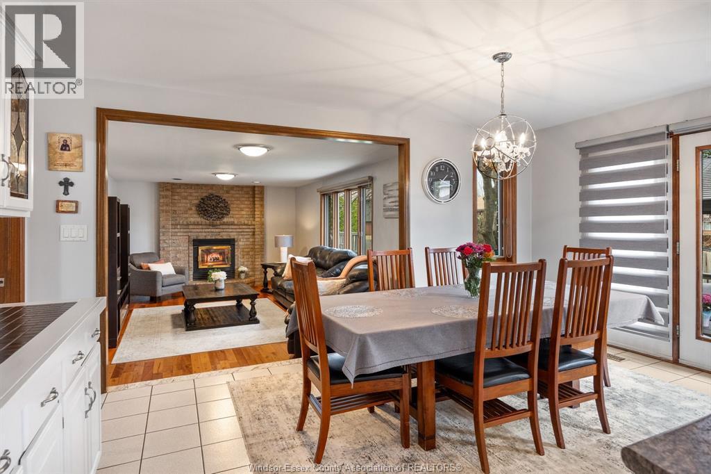 12314 Funaro Crescent, Tecumseh, ON - Indoor Photo Showing Dining Room With Fireplace