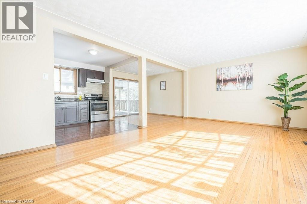 Spacious open-concept living area featuring light wood-finish flooring - 66 Summit Avenue, Kitchener, ON - Indoor