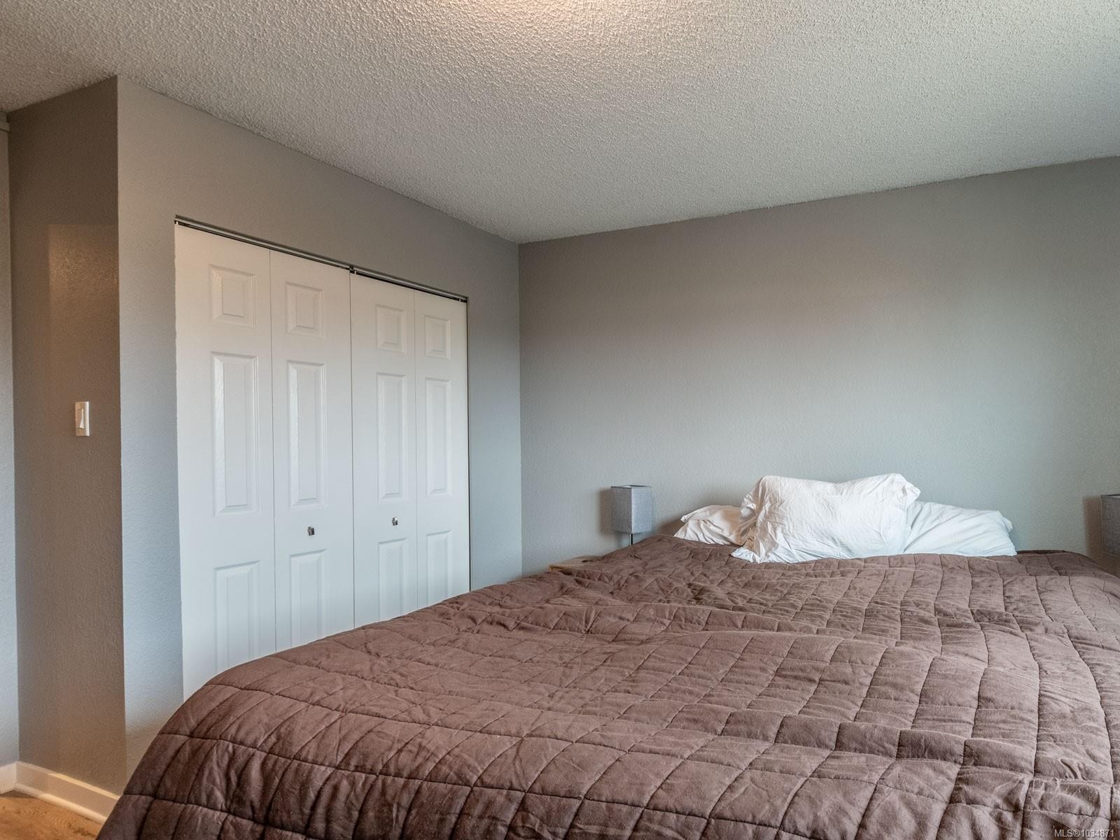 303-218 Bayview Ave, Ladysmith, BC - Indoor Photo Showing Bedroom