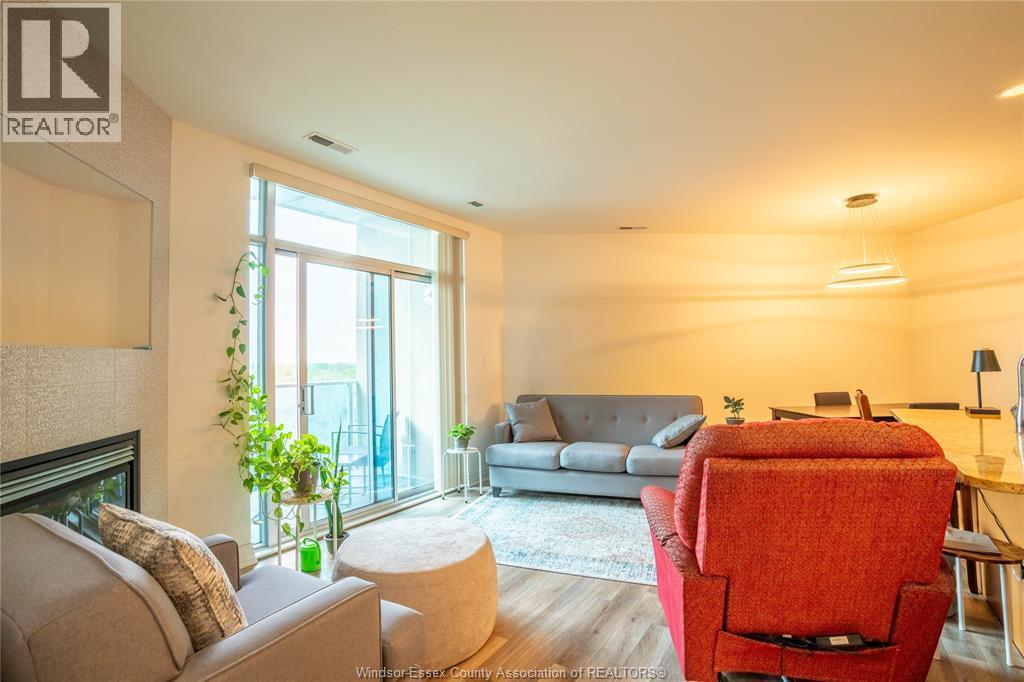 1225 Riverside Unit# 710, Windsor, ON - Indoor Photo Showing Living Room With Fireplace